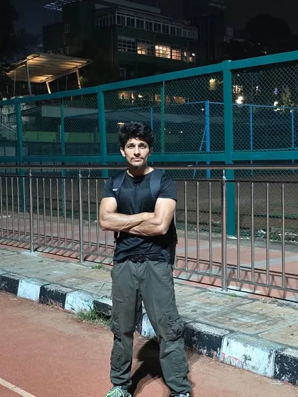 A shot from a night training session on a running track. The work doesn't stop when the sun goes down.