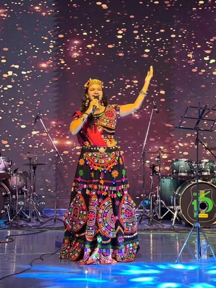 Hosting a Navratri festival is all about channeling divine energy. On stage, I combine my performance with the vibrant traditions of Garba, ensuring the entire crowd feels the festive spirit.