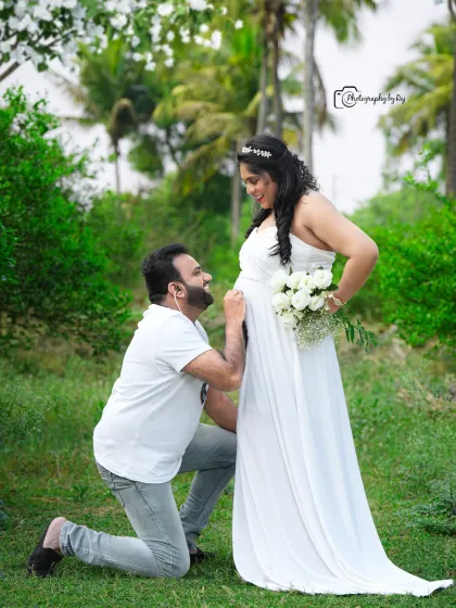 A classic portrait of two friends or sisters in white gowns, sharing a moment of connection in our garden.