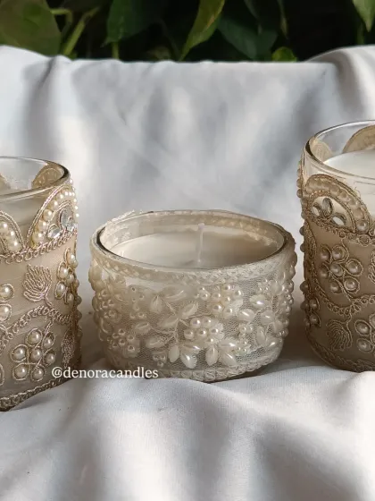 A trio of my decorative lace-wrapped jar candles, showing different designs.