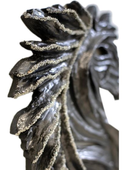 The detailed mane of "The Rising Horse," where every line is carved to create a sense of flowing movement.