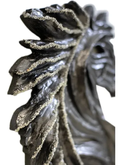 The detailed mane of "The Rising Horse," where every line is carved to create a sense of flowing movement.