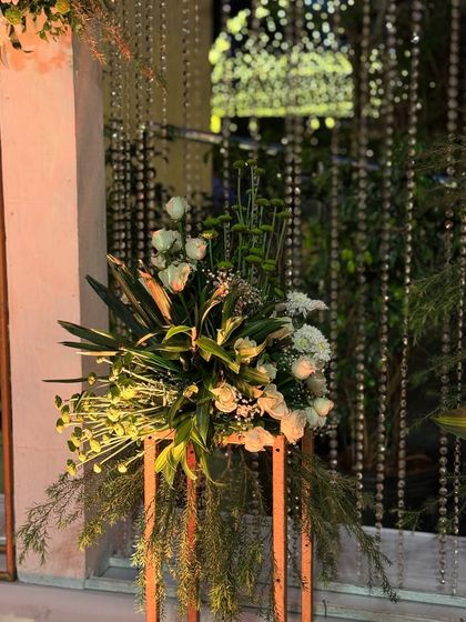 The same floral stand seen from a different angle, showing its versatility and elegance.