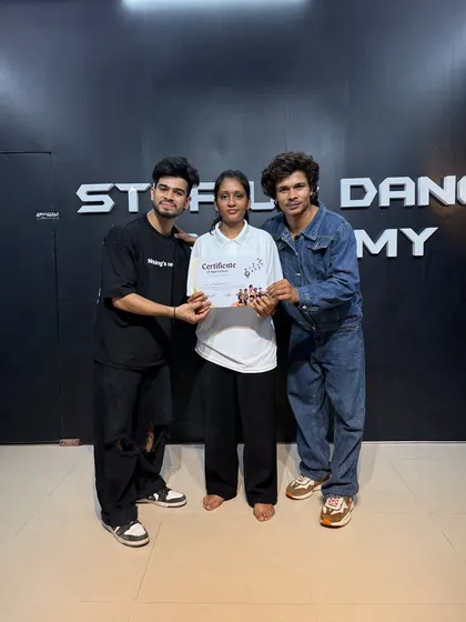 Presenting the certificate to another dedicated student.