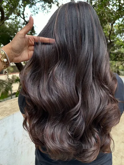 Her first hair color, and we went with a beautiful 'Cocoa Bean' shade. This is a great choice for a first-timer, as it's a subtle, rich brown that enhances natural hair color without being too dramatic.