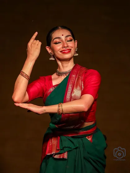 A different angle from the 'Navarasotsava' series, showing the precision and form required in classical dance.