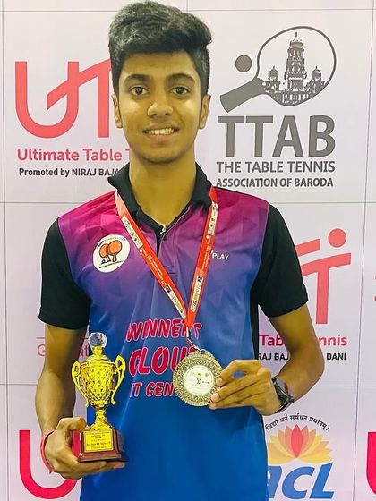 Aakash K J proudly holding his bronze medal and trophy from the All India Ranking tournament in Vadodara.