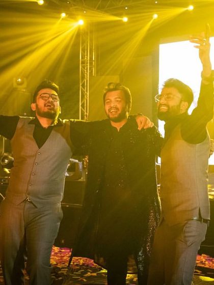 The groomsmen having a blast on the dance floor after their performance. It's all about making memories!