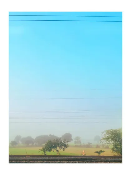This minimalist landscape was shot from a train, showing that you can find beauty anywhere. We'll explore how to edit for a soft, hazy aesthetic using basic adjustments in Lightroom to create a calm and atmospheric image.