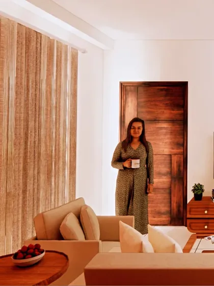 In the living room of the Shekhar Patil residence, I used light-colored furniture and a neutral palette to create a sense of openness. The jute curtain acts as a textured divider, adding warmth without visually closing off the space.