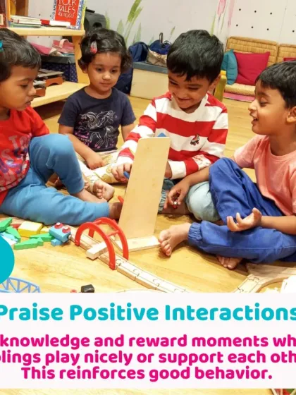 Children learning to play cooperatively with a wooden train set. Praising these positive interactions helps reinforce good social behavior.