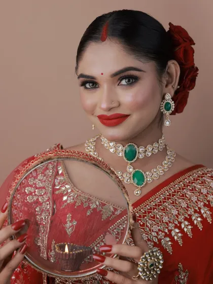 A close-up of the Karva Chauth makeup, with bold red lips and defined eyes.