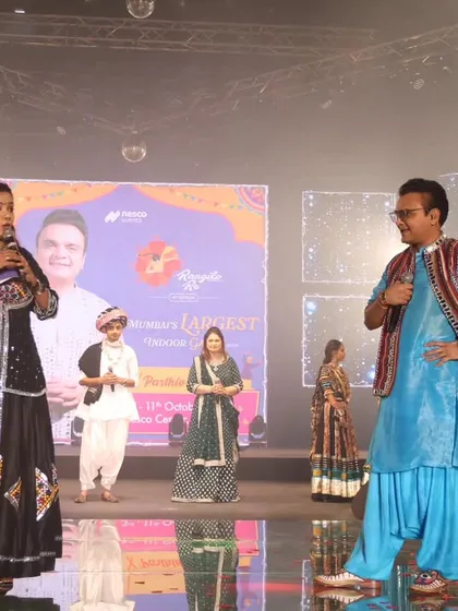 On stage with Tarsame Mittal, demonstrating my experience with corporate and industry events.