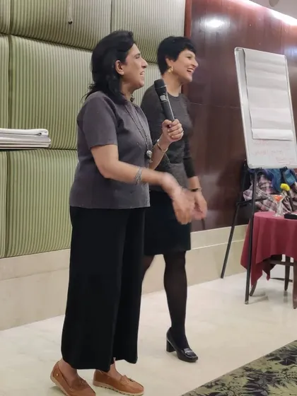 Interacting with another entrepreneur at the Winning Stree meet. I believe in women supporting women.