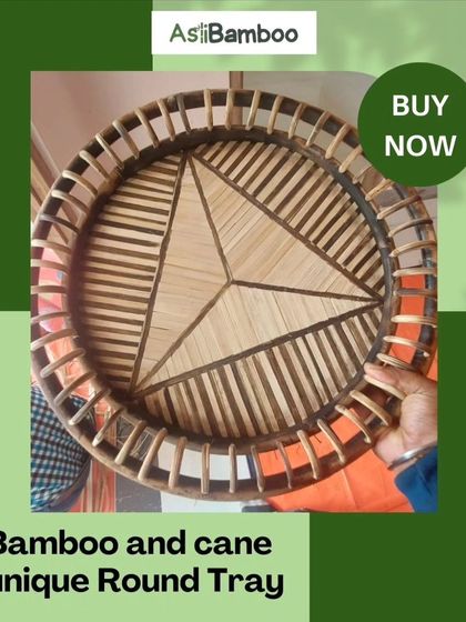 Our unique round tray is crafted from a combination of bamboo and cane. The intricate, geometric pattern in the center makes it a beautiful piece for serving guests or as a decorative base for a centerpiece.