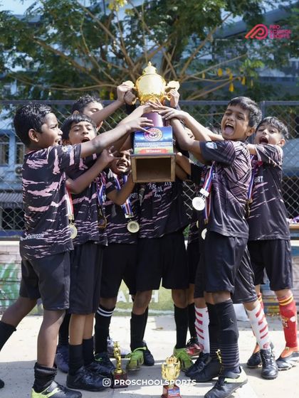 The pure, chaotic joy of victory. A throwback to our young champions celebrating their hard-earned trophy.