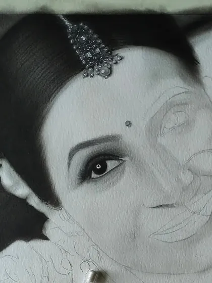 Here I am working on the bride's portrait, with her face and jewelry almost complete. The contrast between the shaded and unshaded areas shows the transformation.