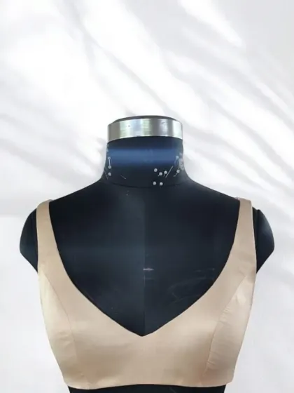 Custom fits create endless charm. This designer bustier in a neutral beige satin can turn any outfit into a statement, offering an elegant and trendy foundation for your look.