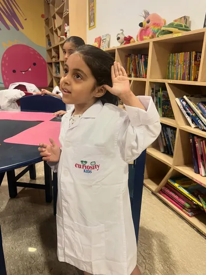 A young student listens intently during our science camp. We aim to spark curiosity and a lifelong love for learning in every child.