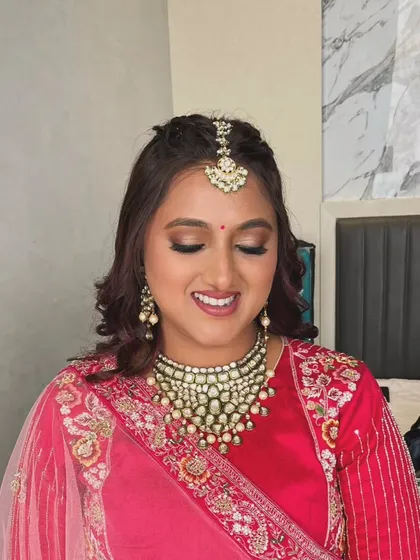 A close-up of the golden eye makeup, which adds a touch of warmth and glamour to the traditional look.