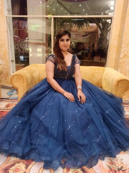 A front-facing view of the navy blue ball gown. The full skirt creates a dramatic silhouette, making you feel like royalty for the night.