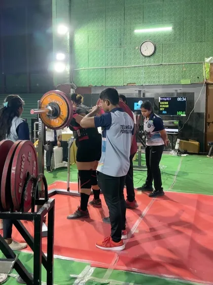 Setting up for a squat at nationals. We practiced bodyweight and light-weight squats pain-free before the meet to build her confidence and test the ankle. This allowed her to hit a 160kg squat for a 10kg personal record.