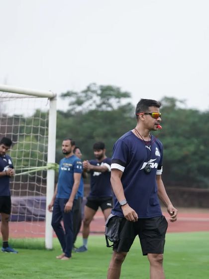 A side profile shot during an outdoor training session. The focus is always on the athletes and their performance.