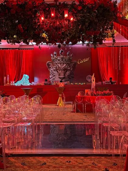 The legacy of Cartier, brought to life in every corner. For this themed event, the entire room was drenched in the brand's signature red, with opulent floral chandeliers and ghost chairs creating a spotlight of pure sophistication.