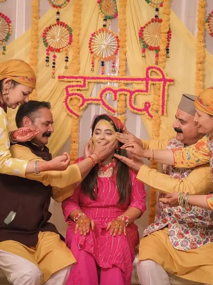 A traditional Haldi moment with the entire family participating in the ritual.