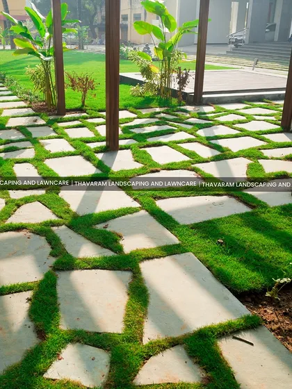 The beauty of a garden is in the details. Here, I've used irregular stone pavers with vibrant green grass growing through the gaps, creating a pathway that feels both structured and organic, inviting you to walk and explore.