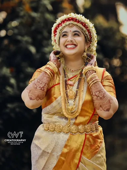 The pure joy of a bride during her 'Phool Muddi' ceremony. As specialists in GSB and Konkani weddings, we understand the significance of each ritual and capture its beauty.