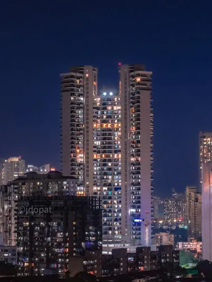 A night shot of Mumbai's modern skyscrapers, with their illuminated windows and architectural details creating a scene reminiscent of Dubai.