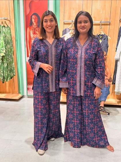 A "twinning" moment with a client in a navy blue printed co-ord set, showing how versatile the style is.