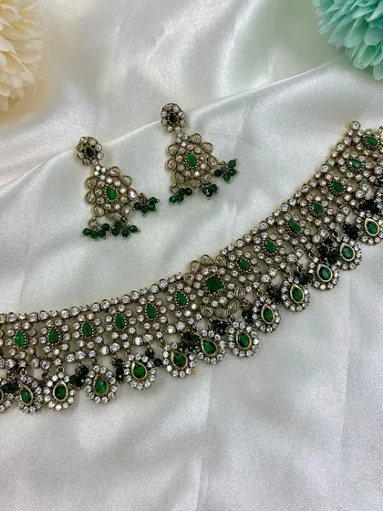 A green and black enamel version of a similar choker style.