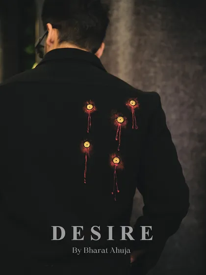 A look at the back of the AK-47 shirt, featuring hand-painted bullet holes for a touch of rebellious artistry.