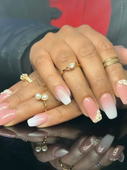 A classic baby boomer ombre on square nails, accented with delicate 3D flowers for a touch of romance.