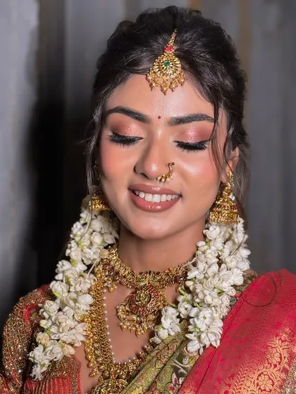 A serene and beautiful close-up, highlighting the flawless, glowing skin and soft pink eyeshadow.