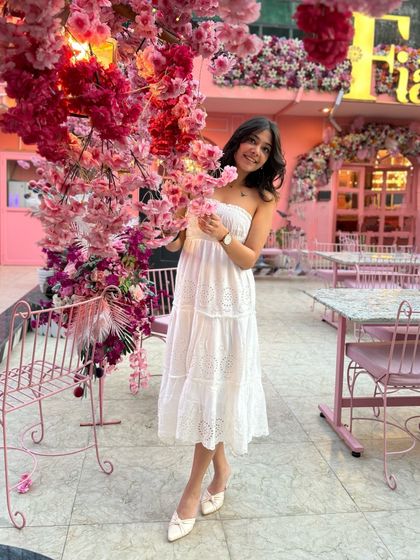 A girl can never have too many flowers or cute dresses. This white strapless dress is perfect for a sunny day out.