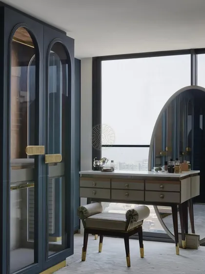 A sleek and modern vanity area for a daughter's bedroom. The blue-grey arched wardrobes with glass doors are paired with a freestanding vanity table and a large oval mirror, creating a chic and functional space.
