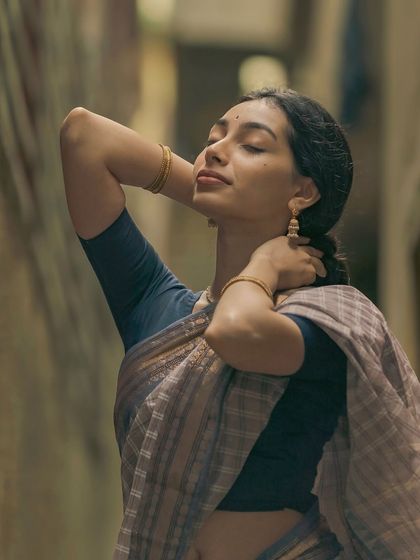 A moment of peace during a shoot in the busy lanes of Gandhi Bazaar. Even in a chaotic environment, I can find a quiet moment and expression that tells a story.
