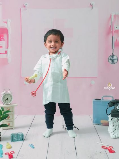 A happy and welcoming little doctor. The joy on his face shows how much fun toddlers have when they get to play dress-up and explore our creative worlds.