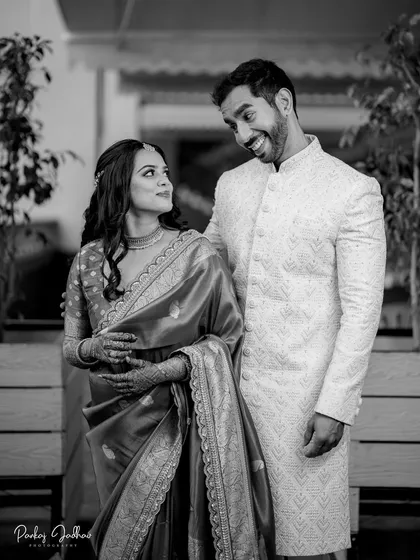 A playful and candid moment between Ojasi and Rutvik, where their expressions tell the whole story in this black and white frame.