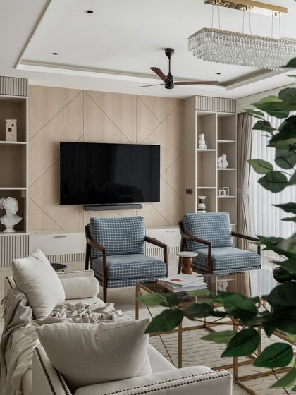 Another angle of the English-inspired living room, showing the TV unit and shelving. The design maintains a clean and elegant look, with symmetrical shelves that are perfect for displaying art and decor.