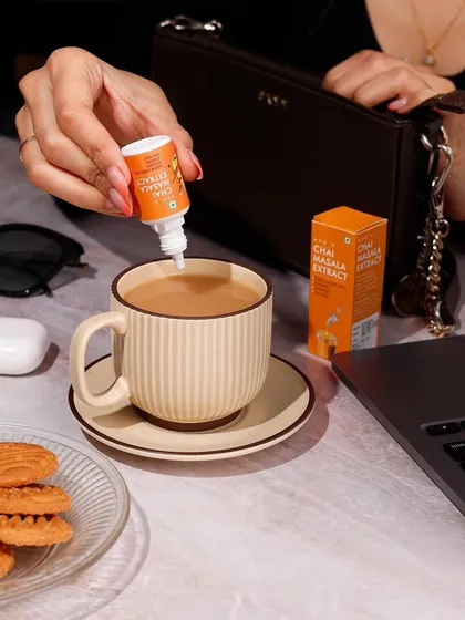This lifestyle photo shows Sprig's Chai Masala Extract in a natural, everyday work setting. My goal here is to place the product directly into the customer's life, making it feel both aspirational and essential for their daily routine.