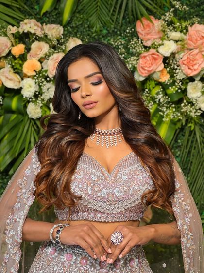 A close-up on the beautiful pink and purple smokey eye. This is a great way to add a touch of color to your reception look.