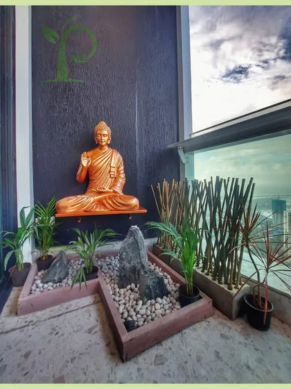 I designed this balcony as a personal Zen garden, a space for peace and meditation high above the city. The design integrates a calming Buddha statue, minimalist rock arrangements, and carefully selected plants like Areca palms to create a tranquil atmosphere.