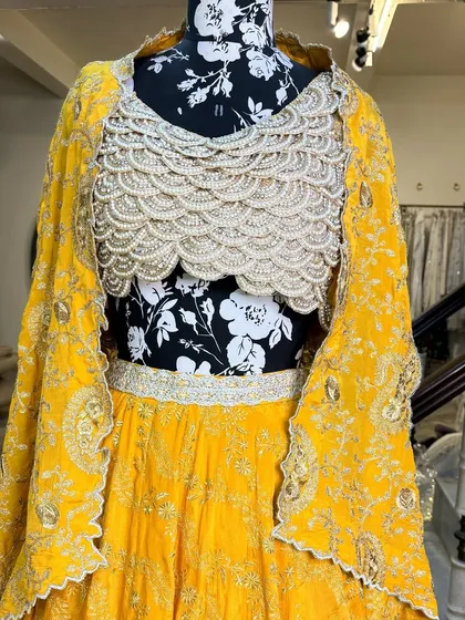 The full view of the haldi lehenga, showcasing the flowy skirt and the statement blouse.