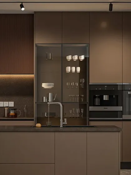 My Seamless Series is all about creating a kitchen that feels like poetry in motion. This design features handleless cabinets in earthy tones, a glass-fronted crockery unit, and fully integrated appliances. It’s a perfect example of how I blend minimalist aesthetics with high functionality for a truly premium experience.
