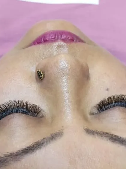A clear, top-down angle of a dense volume lash set. This perspective shows the uniform curl and length that we achieve, resulting in a polished and dramatic finish.