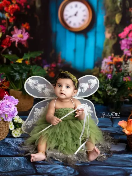 A sweet little fairy sitting in a magical garden. I love creating these whimsical and imaginative sets for children's fantasy photoshoots.